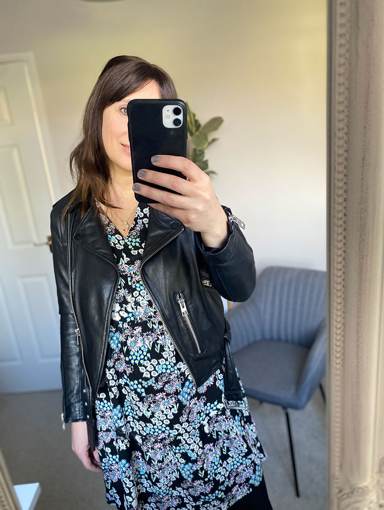 Black floral mini dress with tights and boots