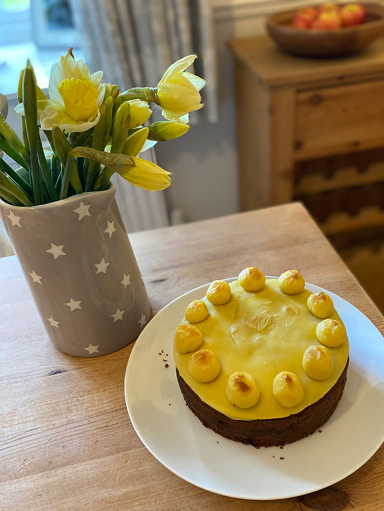 Simnel cake with spring daffodils