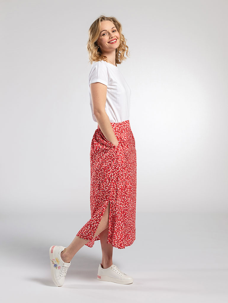 Red skirt and trainers