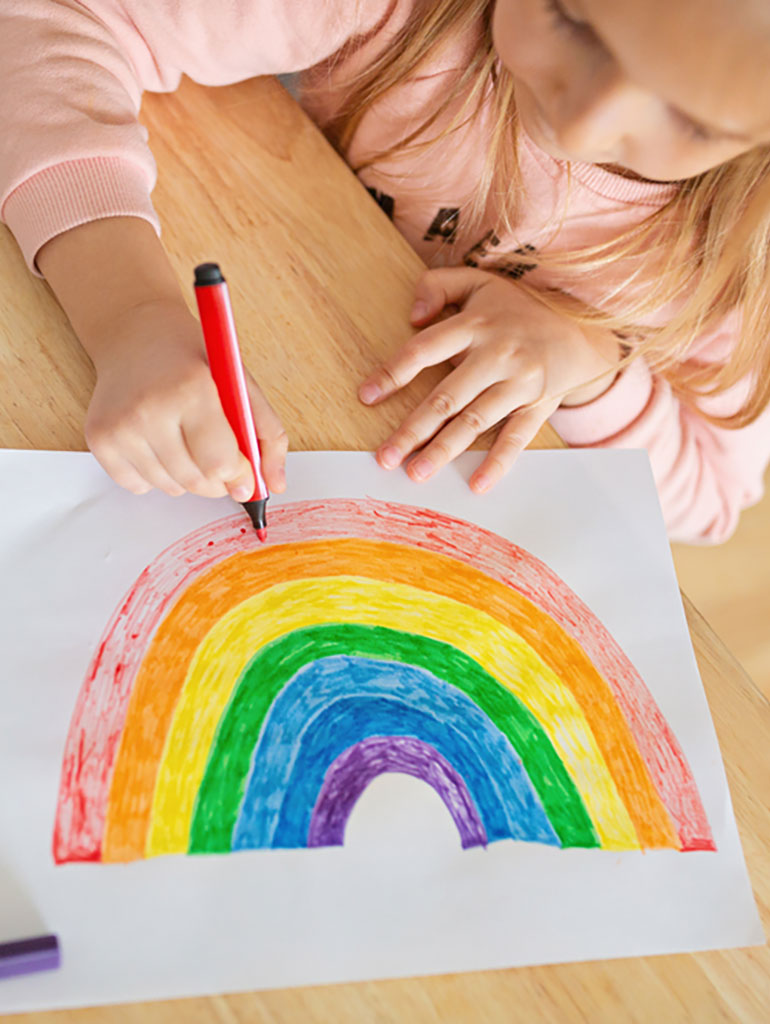 Child colouring rainbow